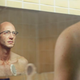 Biological researcher Randall Palinack examines the absolutely pitiful specimen in the mirror.